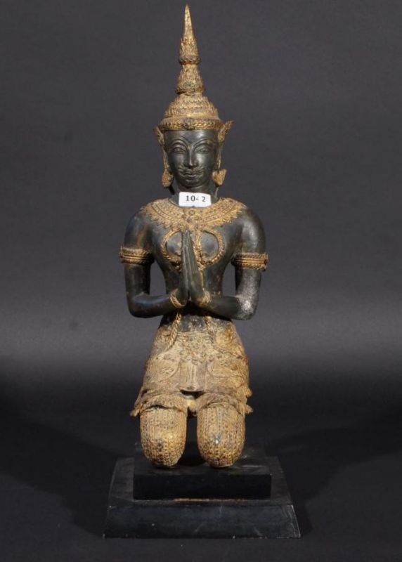 Thai kneeling servant, partly gilt, on wooden base, early 20th century, h. 44 cm. 27.00 % buyer's