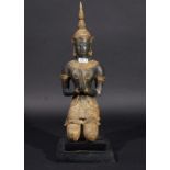 Thai kneeling servant, partly gilt, on wooden base, early 20th century, h. 44 cm. 27.00 % buyer's