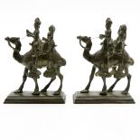 Pair of Bronze Sculptures of Men on Camels