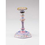 A candlestick Polychrome enamel on yellow metal Hexagonal base decorated with floral frieze, stem