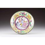 A plate Polychrome enamel on copper Centre decorated with oriental figures and animals Tab with