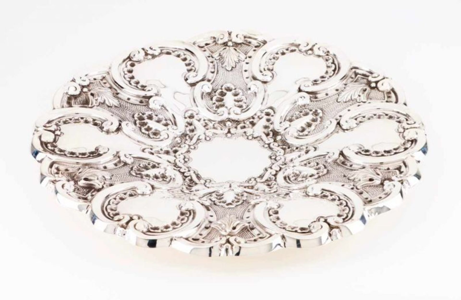 An hanging salver Portuguese silver Relief and chiselled decoration in the baroque manner with