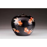 A vase with cover Chinese porcelain Decoration in shades of coral on black ground depicting carps