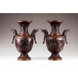 A pair of baluster vases Bronze Relief decoration depicting floral motifs, birds and elephant head