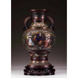 A baluster vase Patinated bronze Relief decoration with geometric motifs and polychrome cloisonné