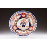 A charger Japanese porcelain Polychrome and gilt Imari decoration with garden view and profuse