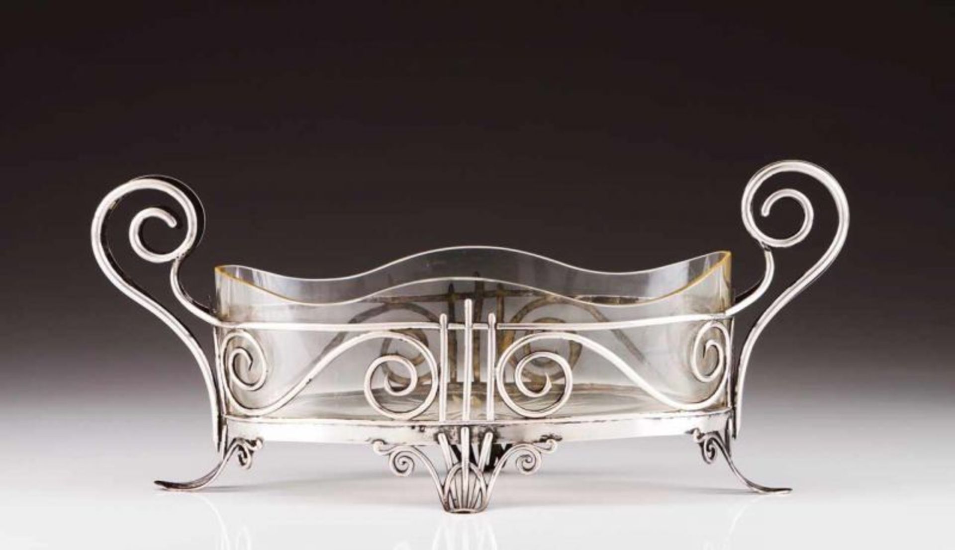 An Art Nouveau flower bowl Silver wire structure decorated with volutes, crystal lining with