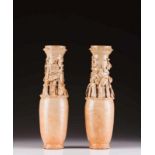 A pair of ceremonial vases Glazed stoneware Relief decoration depicting oriental motifs China, Song