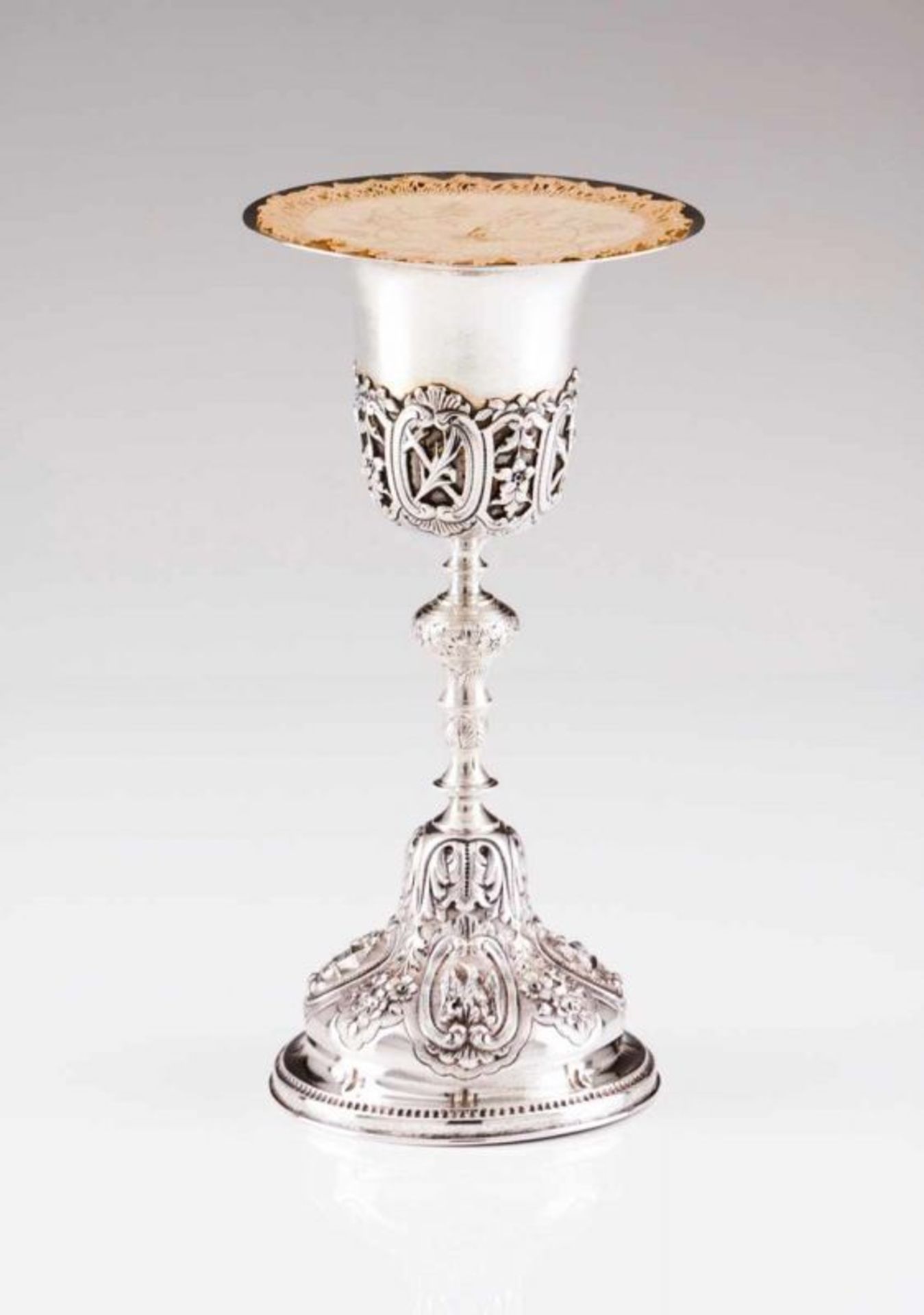 A chalice with paten Portuguese silver of the late 19th, early 20th century Relief and chiselled