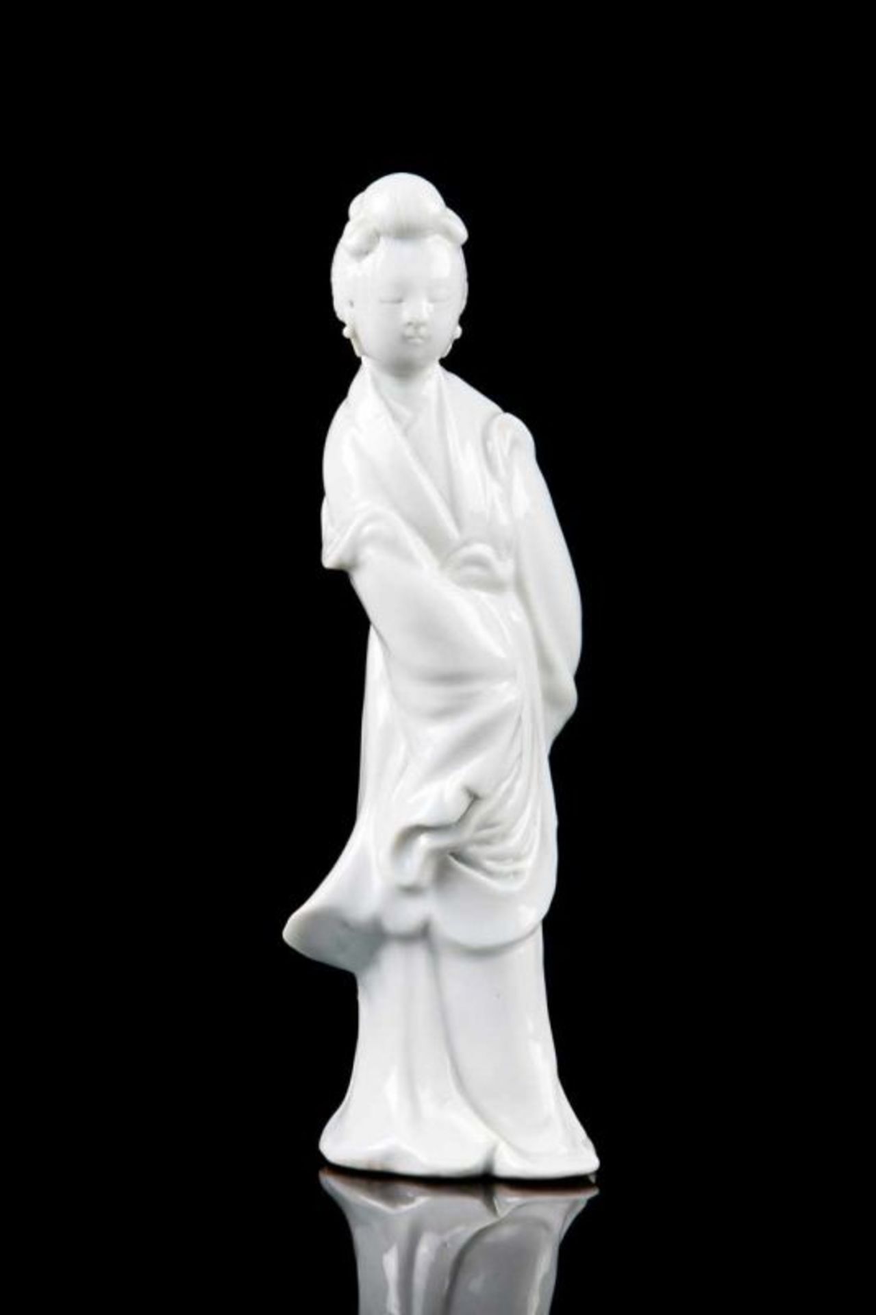 A Chinese Dehua (blanc-de-chine) porcelain sculpture of Guanyin China, 20th century Height: 20 cm