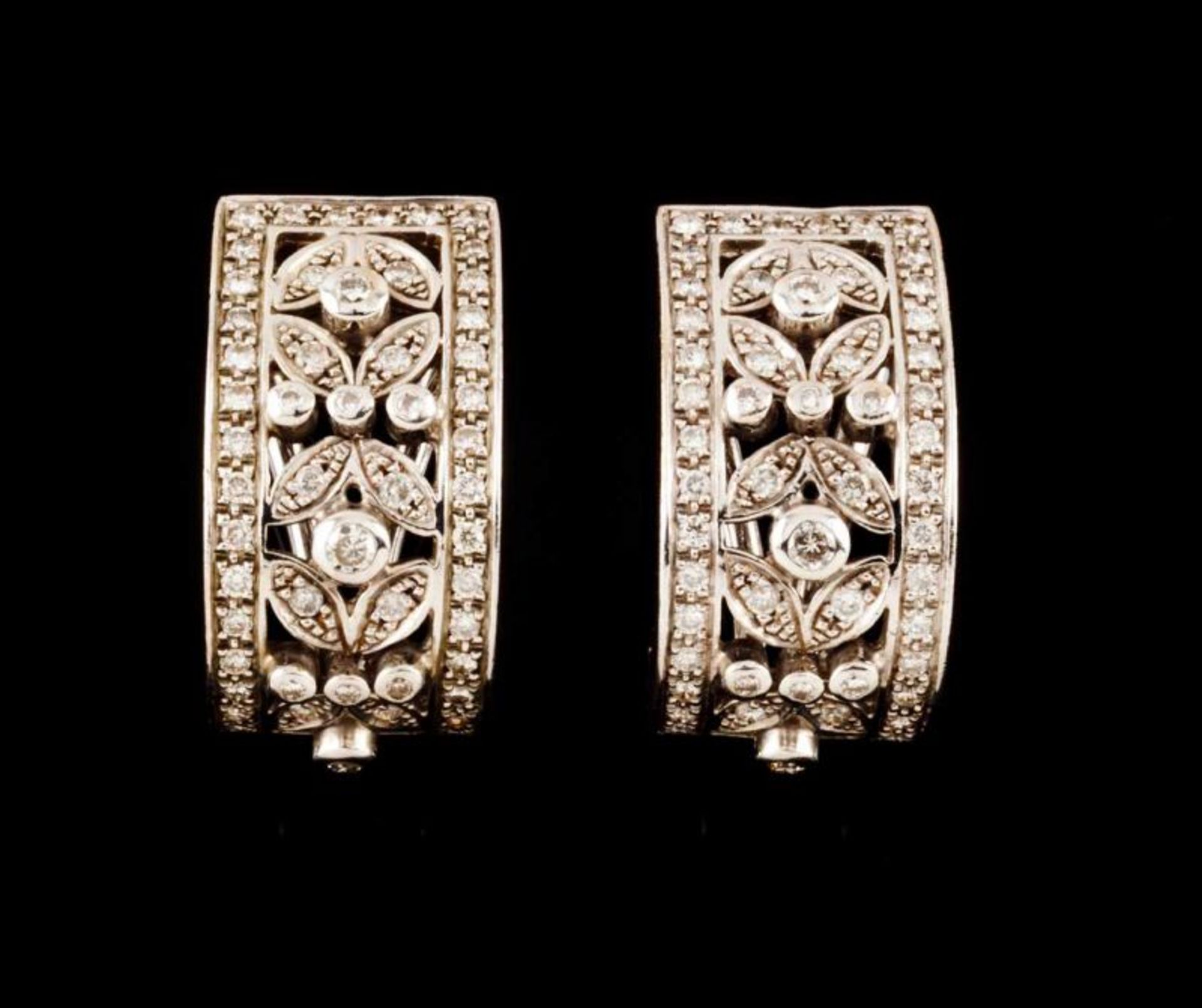 A pair of earrings Set in white gold with 106 small brilliant cut diamonds (ca. 0,50ct) Assay