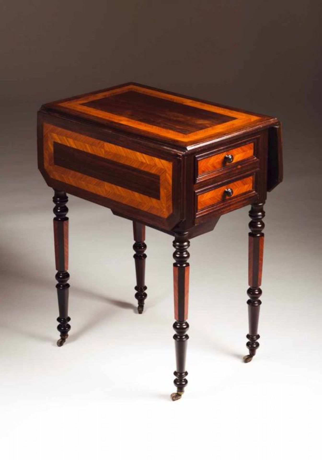 A Romantic work table Rosewood and thornbush Two drawers, one door and two folding tabls Faceted