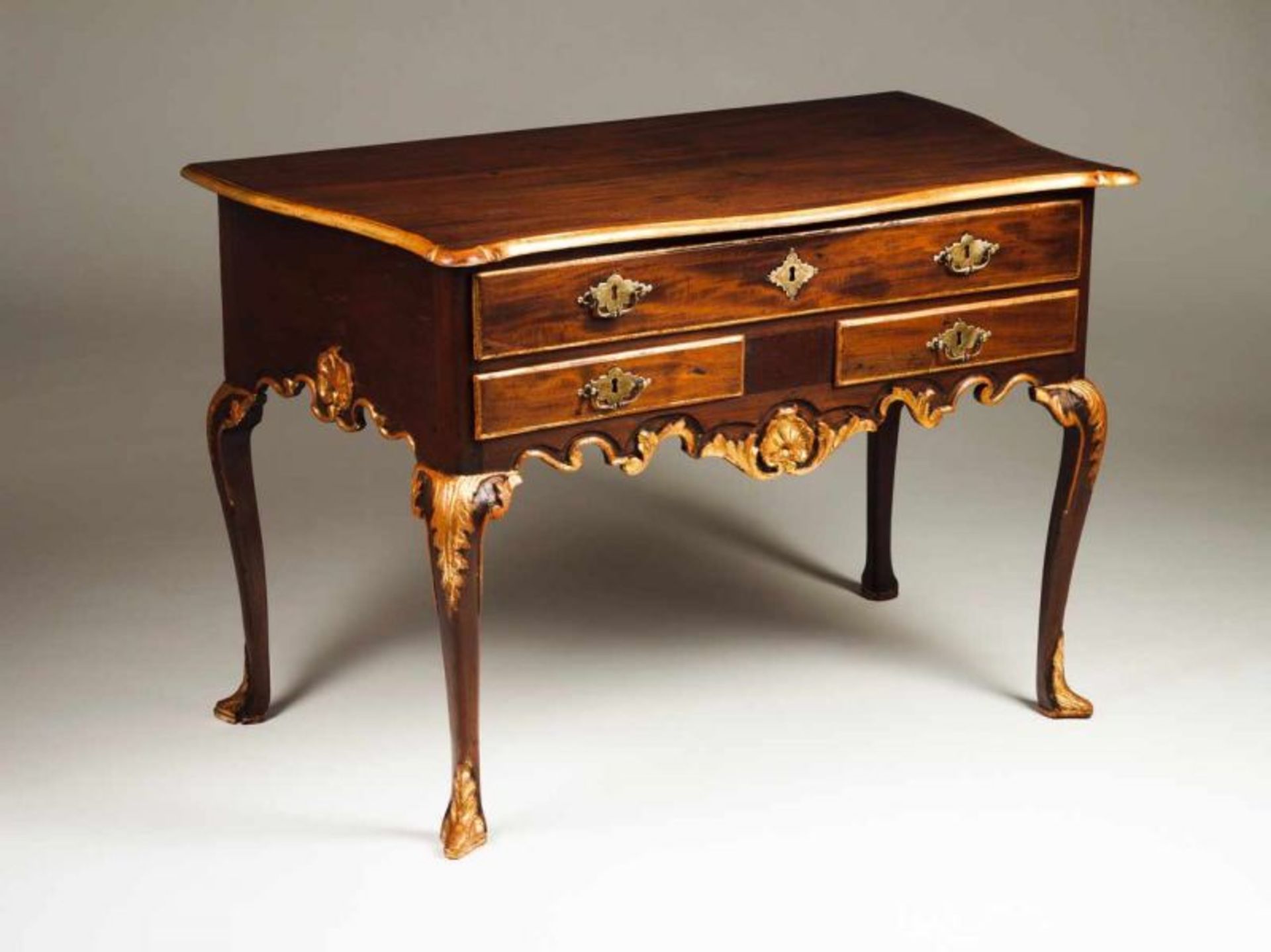 A D. João V (1707-1750) side table Walnut with gildings Three drawers Scalloped, carved and gilt
