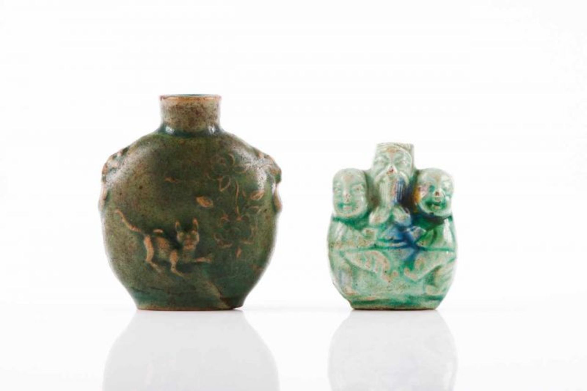 Two snuff-bottles Grenn glazed stoneware One shaped as a old man with children and the other with