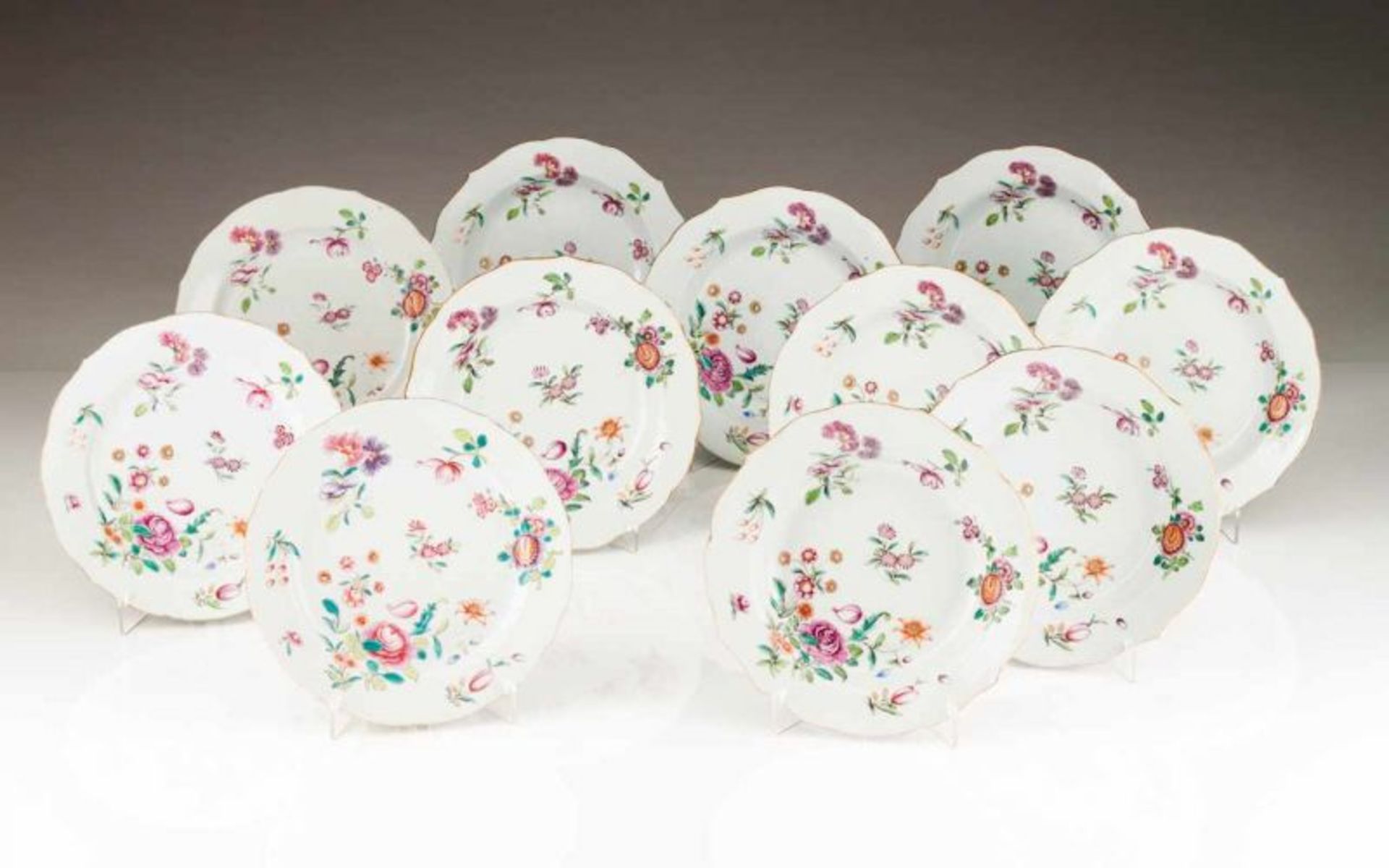 A pair of scalloped soup plates Chinese export porcelain Polychrome Famille Rose, rouge de fer and
