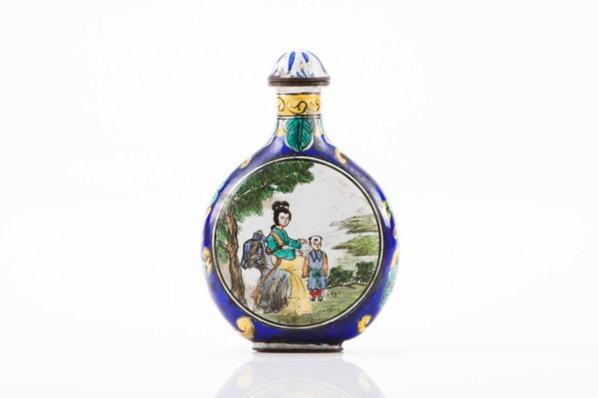 Snuff-bottle Brass and polychrome enamel Decorated with floral motifs on blue ground and two