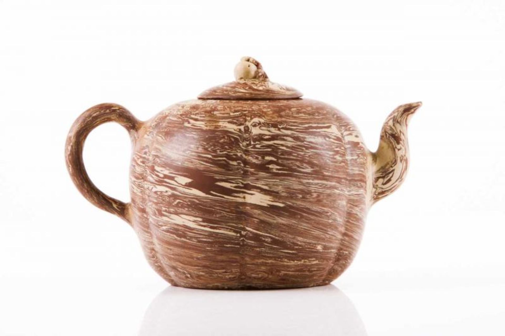 An Yixing tea pot Two-toned marbled clay Fluted body and fruit shaped cover finial Marked at the
