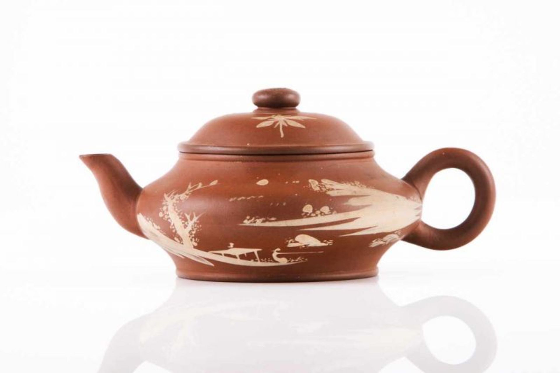 An Yixing tea pot Dark red clay Light slip decoration depicting landscape, floral motifs and