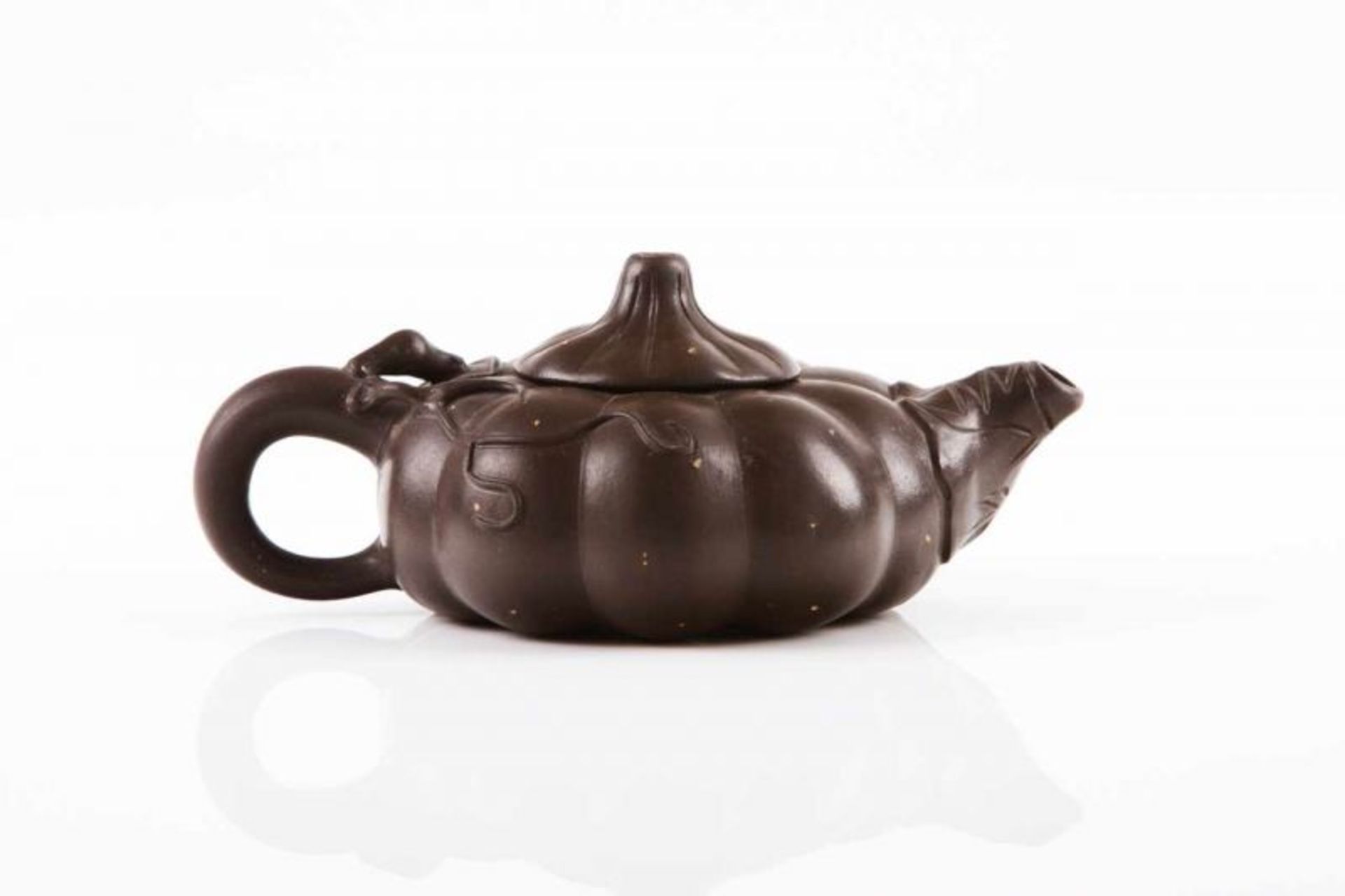 An Yixing tea pot Dark toned clay decorated with Pu Sha Pumpkin shaped body Marked at the base