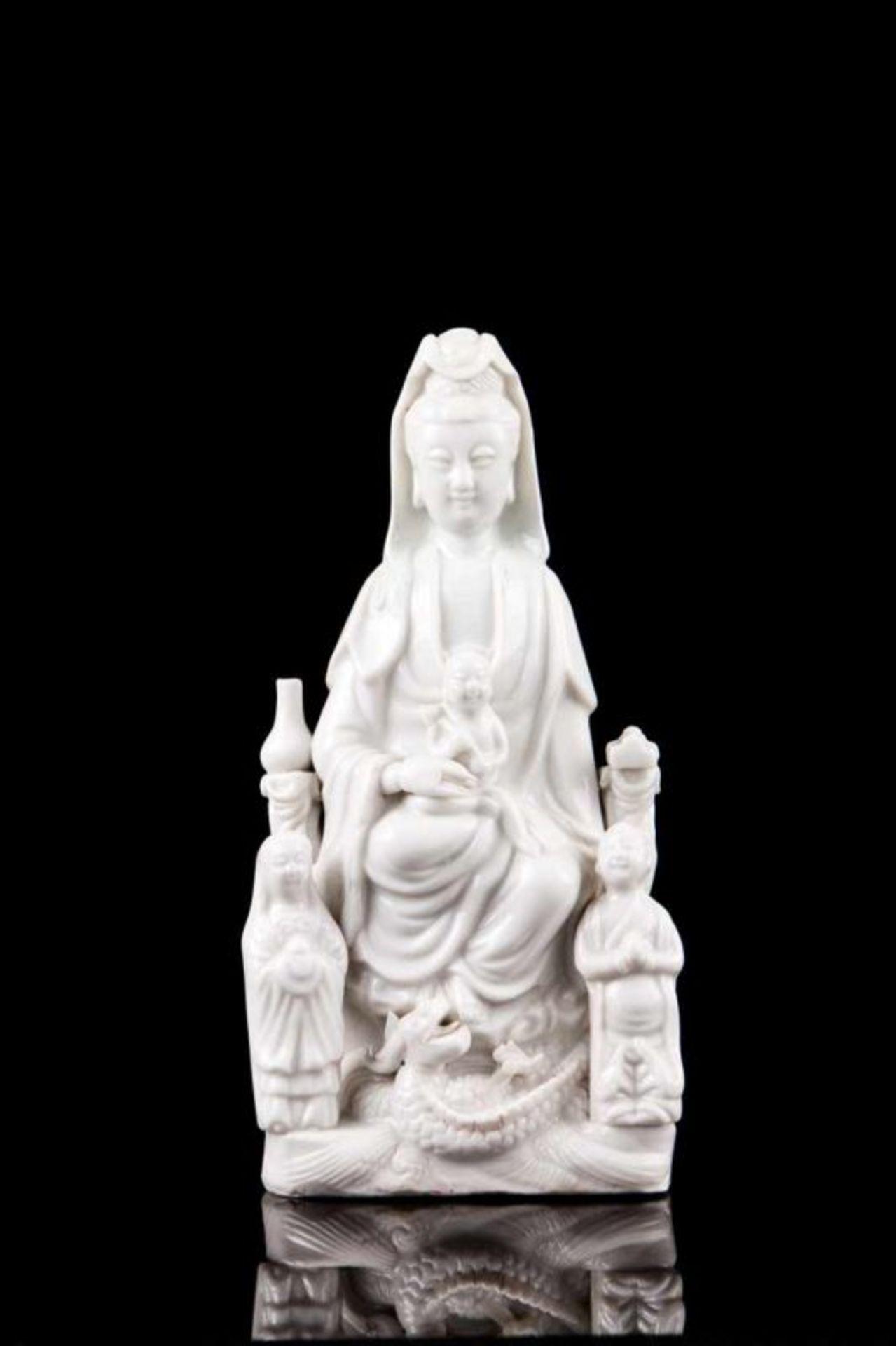 Song Zi Guanyin A Chinese Dehua (blanc-de-chine) porcelain sculpture Depicting seated Guanine with