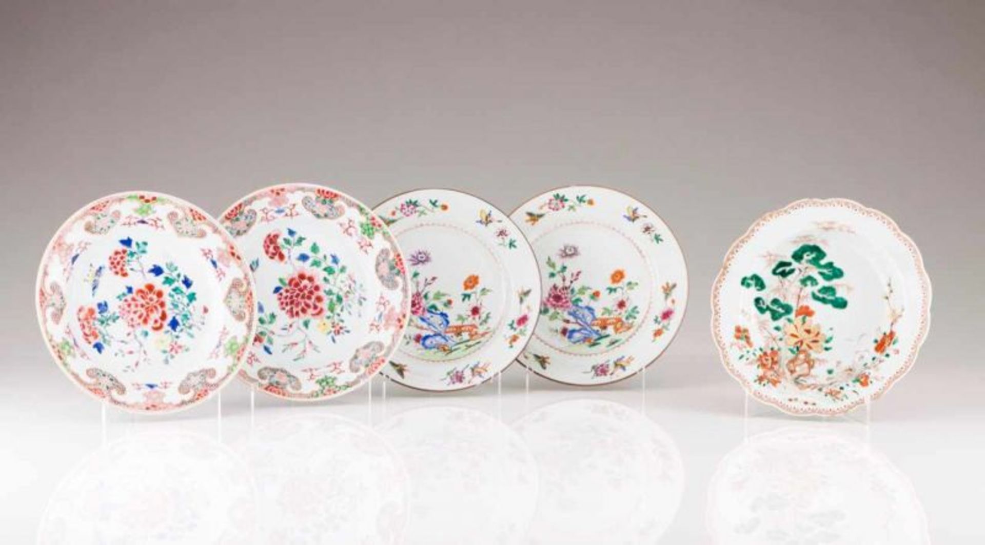 A pair of plates Chinese export porcelain Polychrome and gilt Famille Rose decoration depicting