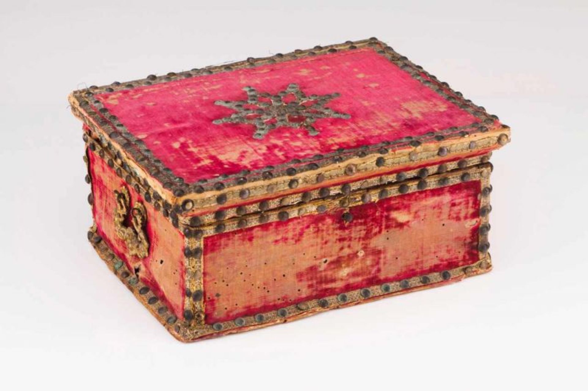 A Renaissance coffer Red velvet lined wood, decorated with pins at the cover Zoomorphic handles