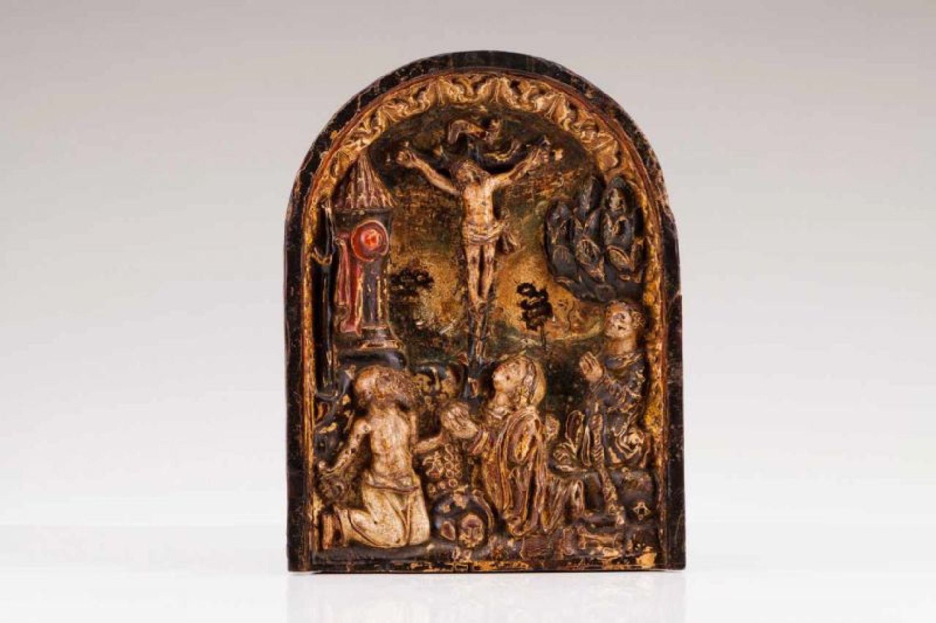 Crucified Christ, Saint Anthony and Saint Jerome A carved, polychrome and gilt chestnut retable