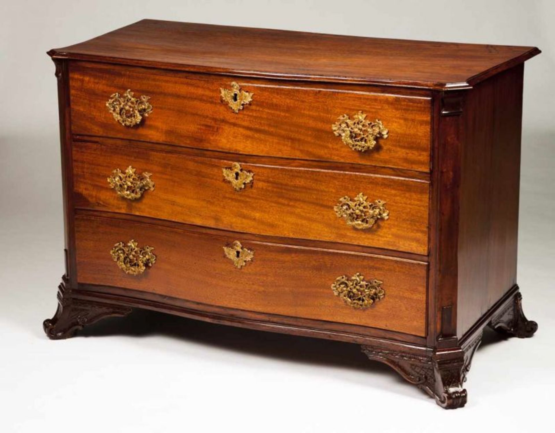 A D. José (1750-1777) commode Brazilian mahogany and rosewood Carved scroll feet Three long drawers