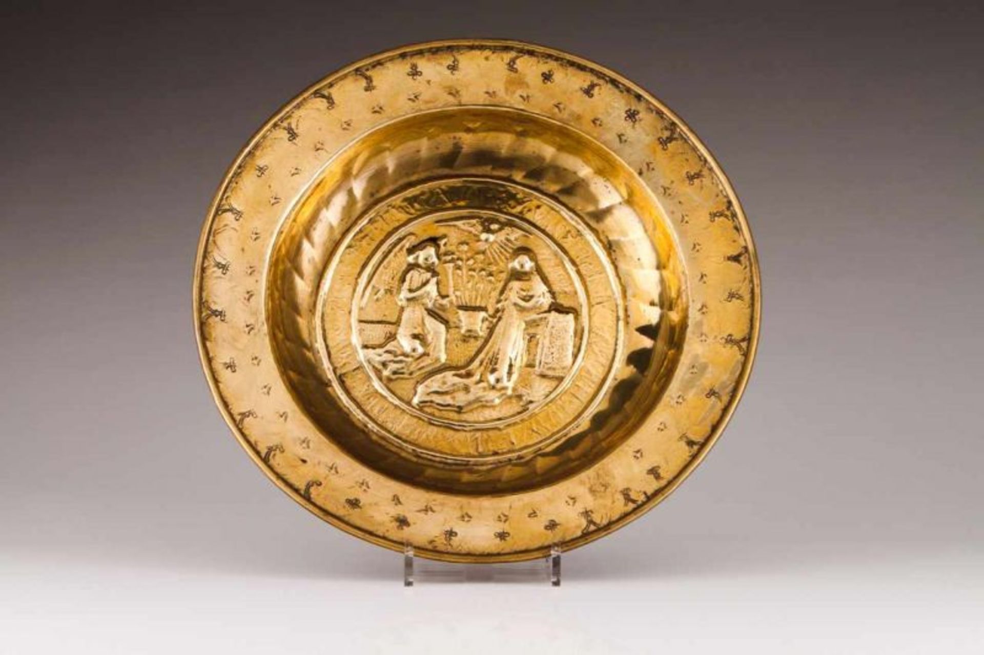 A Nuremberg alms dish Brass Decorated in relief depicting "Annunciation" Germany, 16th century (
