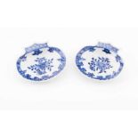 A pair of scalloped shells Chinese export porcelain Blue decoration depicting flowers Qianlong