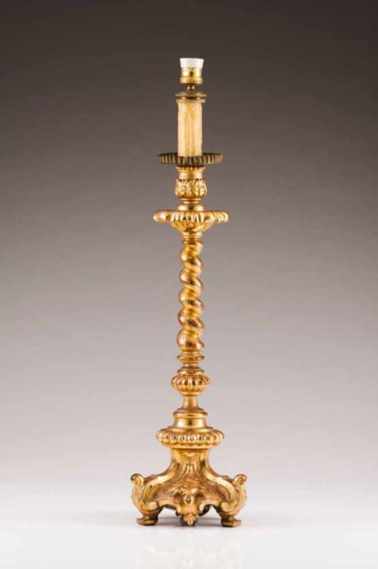 A torchére Carved and gilt wood Turned stem Italy, 19th century (mounted as a lamp) Height: 77 cm