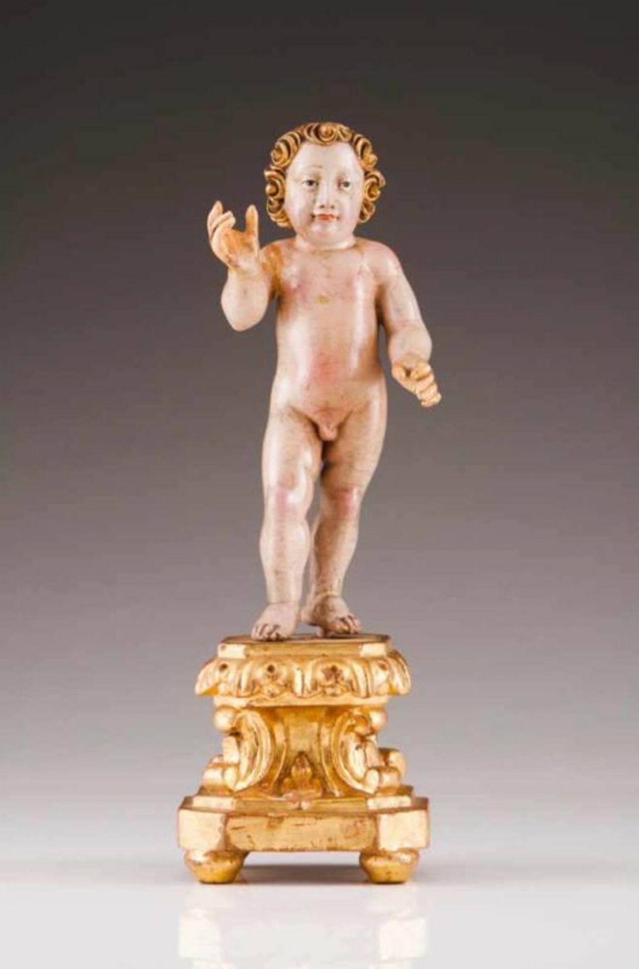 Child Jesus Polychrome and gilt wood sculpture Carved and gilt base Portugal, 18th century (