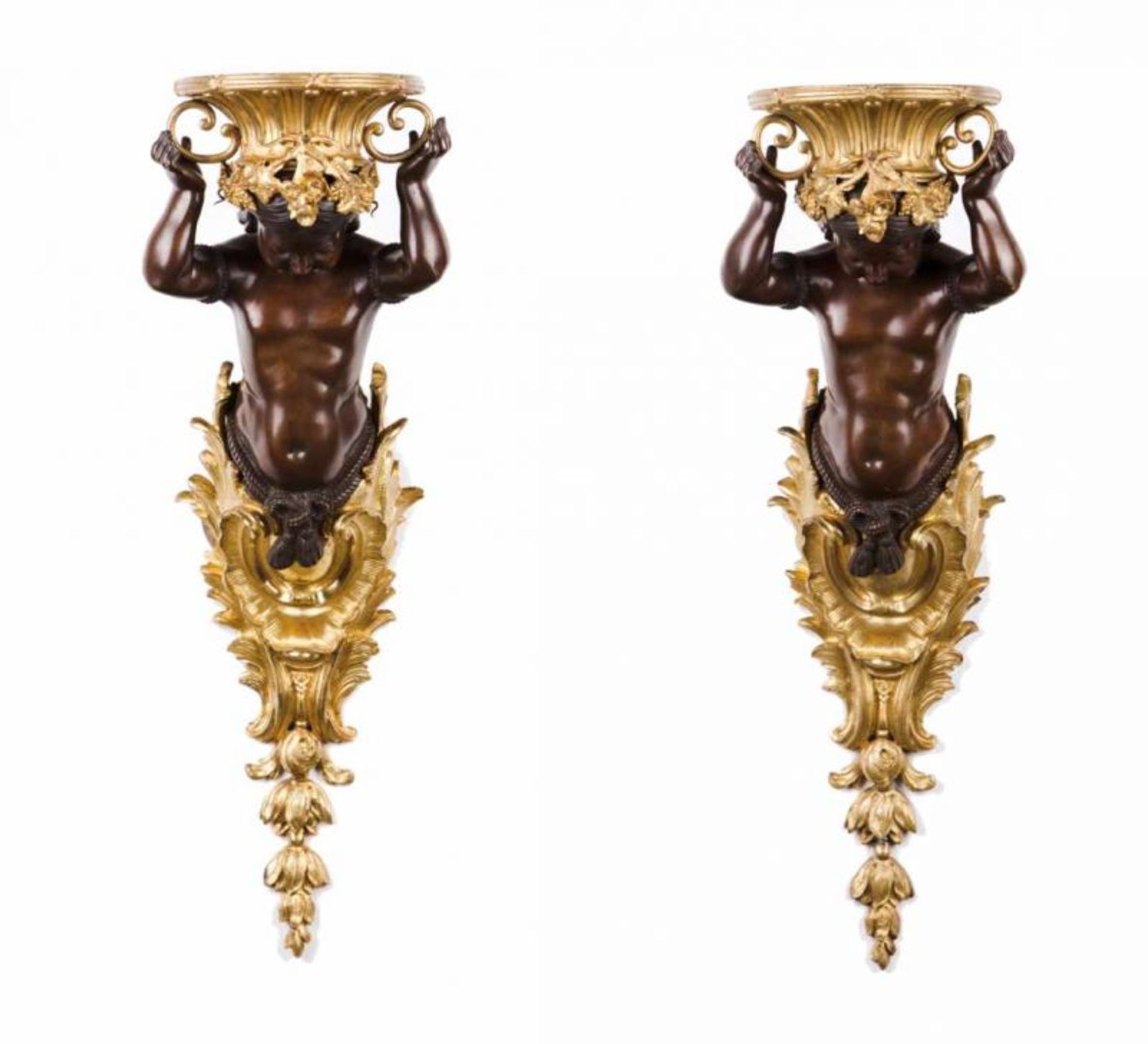 A pair of wall stands Gilt and patinated bronze Depicting Indians with chiselled decoration France,