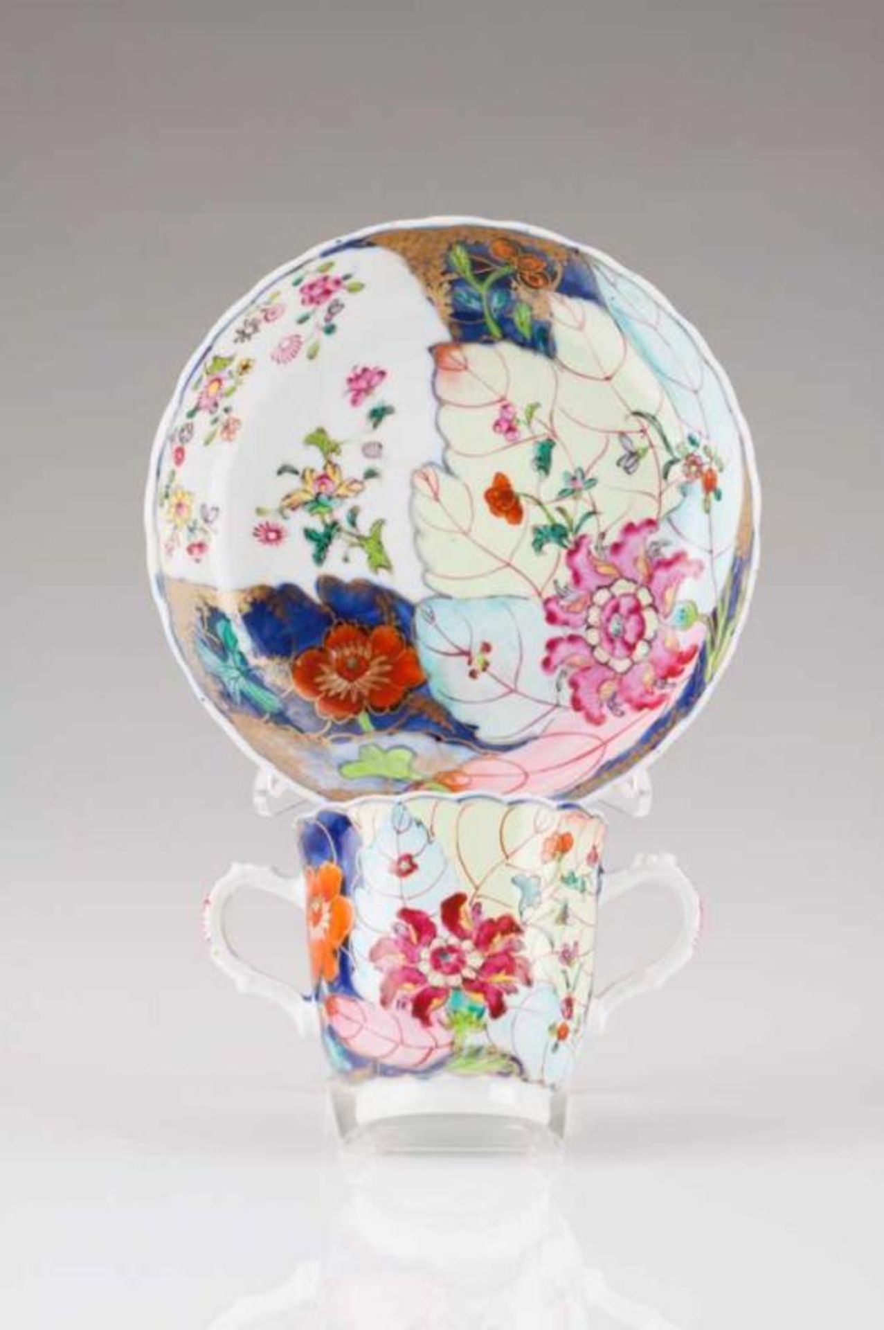 A two handle cup and saucer Chinese export porcelain Polychrome and gilt "Tobacco Leaf" decoration