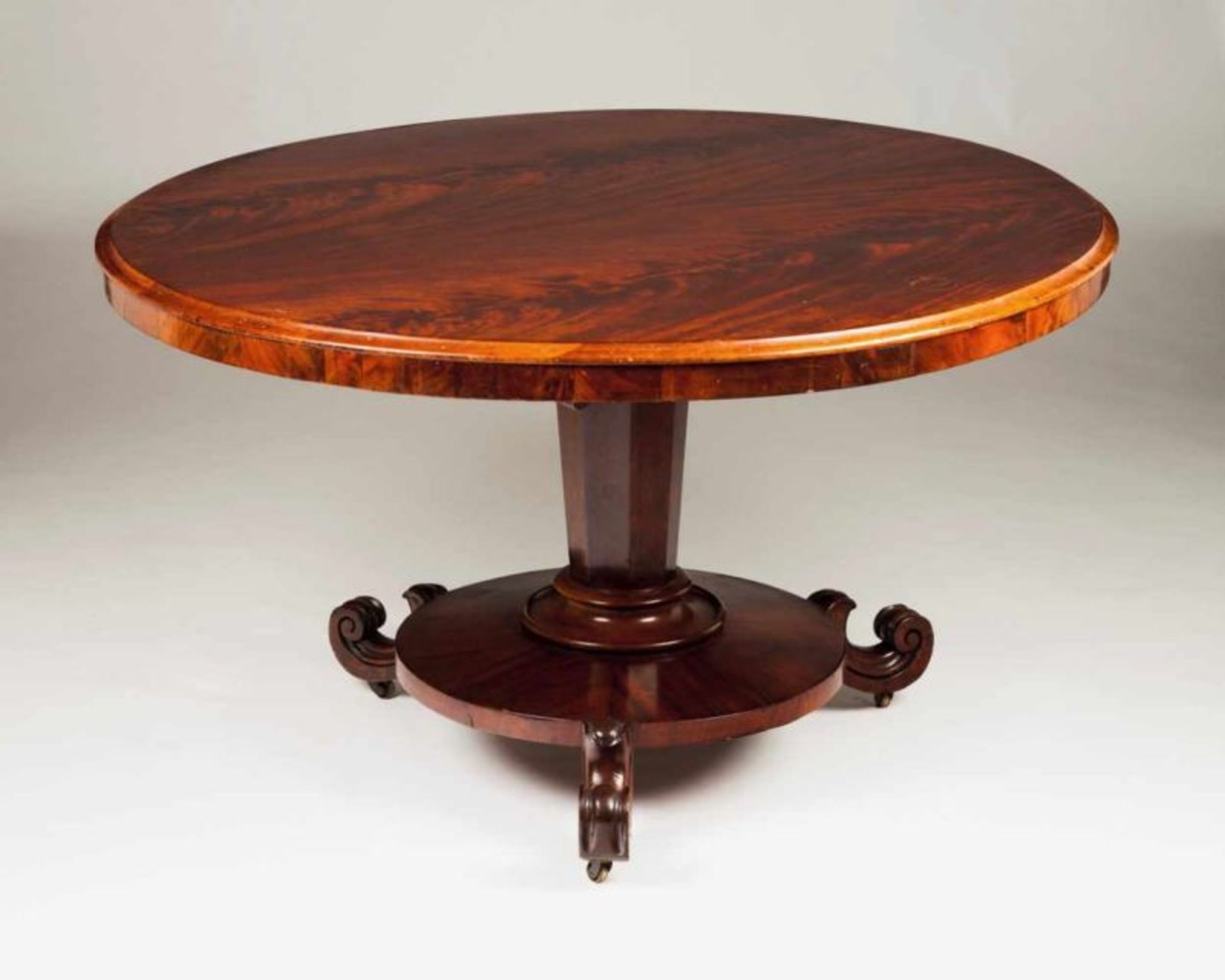 A Regency breakfast table Rosewood veneered rosewood Tilt-top, central columns and carved feet