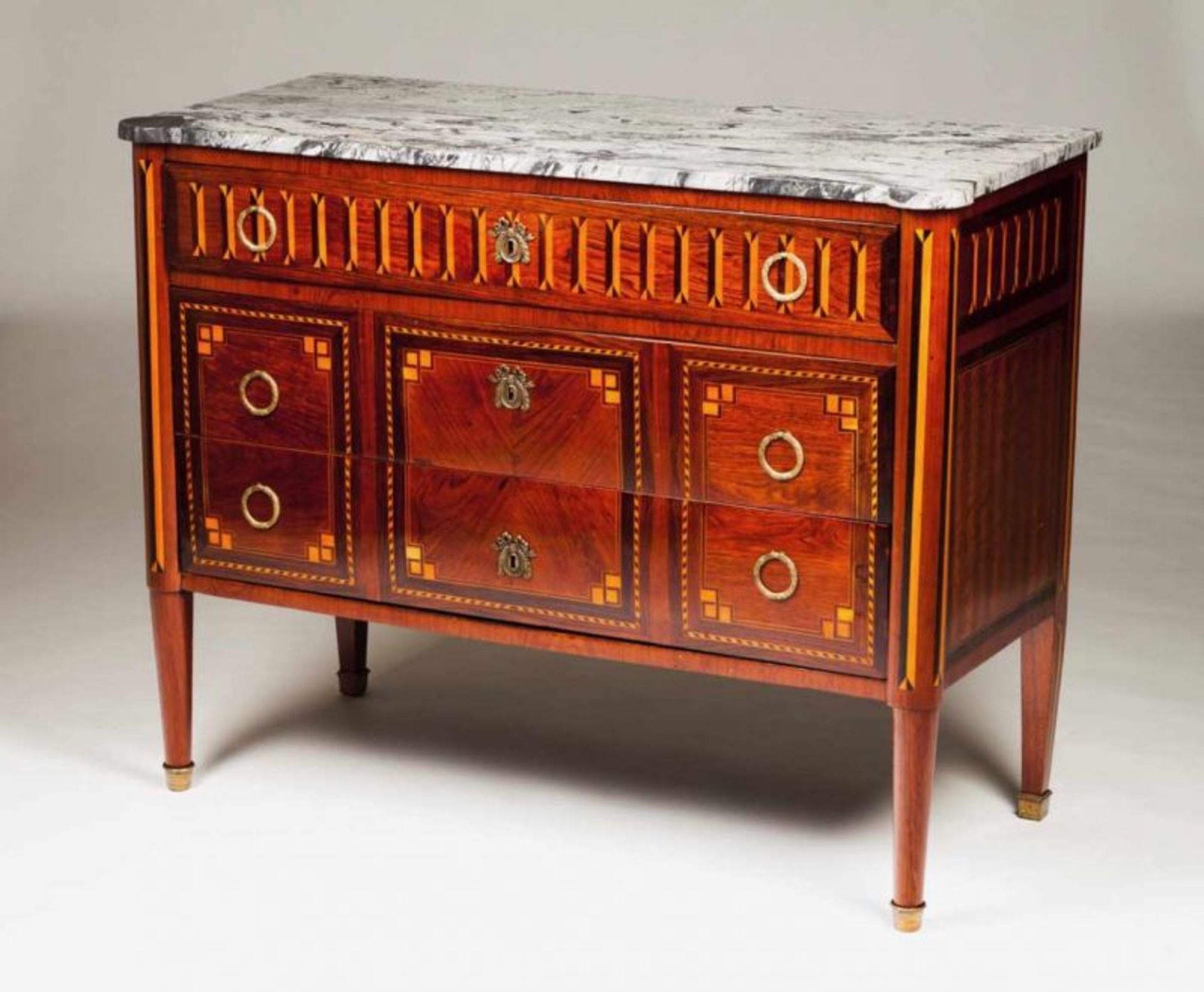 A D. Maria style commode Rosewood veneered wood, thornbush inlays Three long drawers and brass