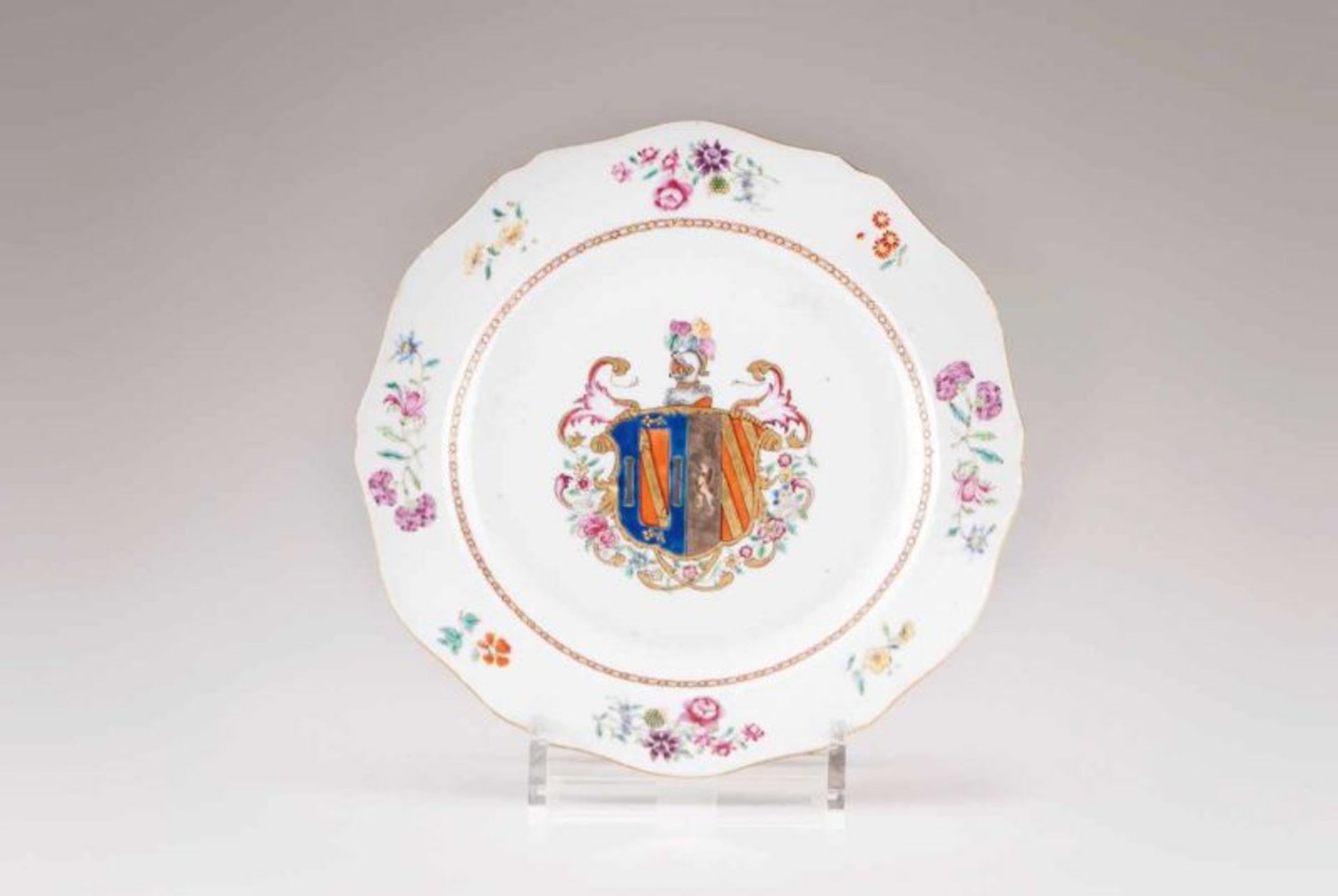 A scalloped plate Chinese export porcelain Polychrome Famille Rose decoration bearing coat-of-arms,