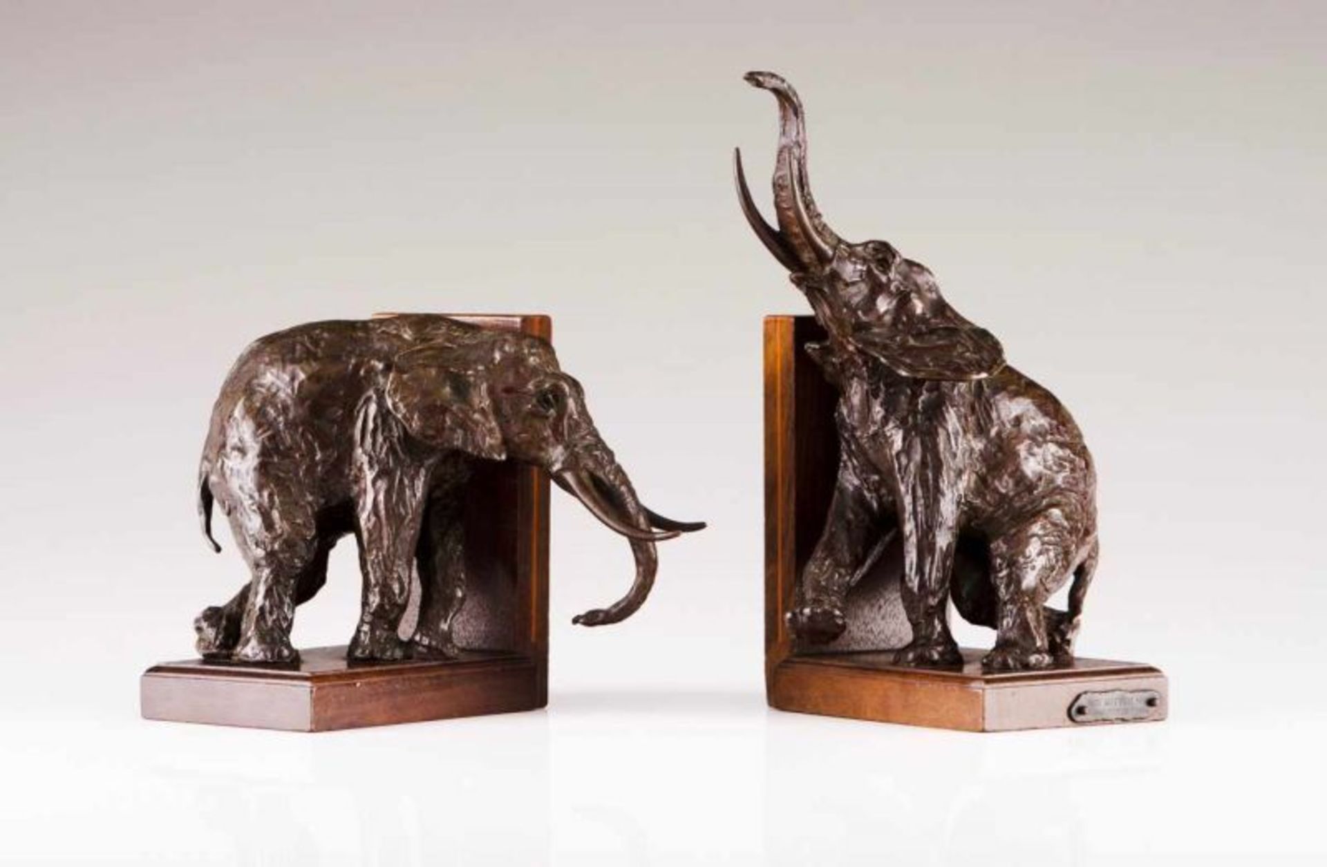 Ary Bitter (1883–1973) A pair of book ends Bronze sculptures representing elephants Wood bases One