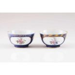 A pair of bowls Chinese export porcelain Powder blue decoration with polychrome cartouches