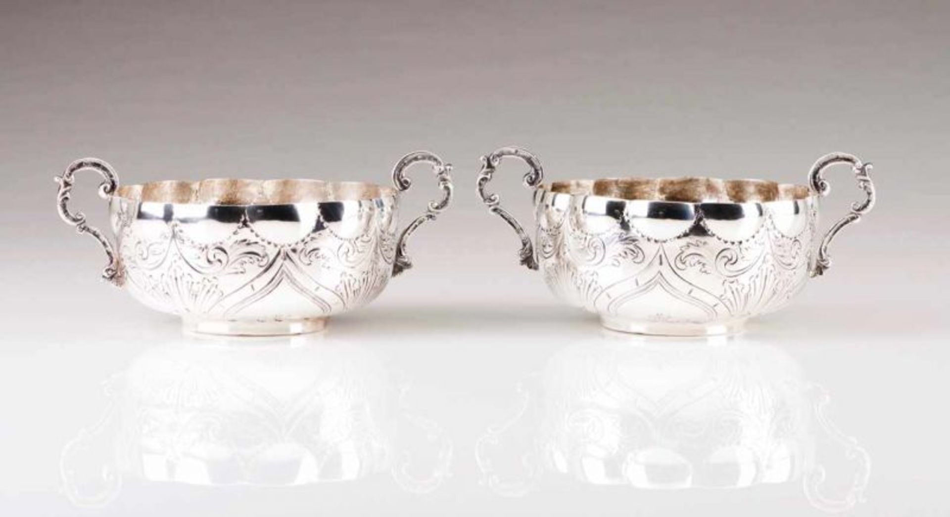 A pair of large porringers Portuguese silver of the late 19th, early 20th century Relief and