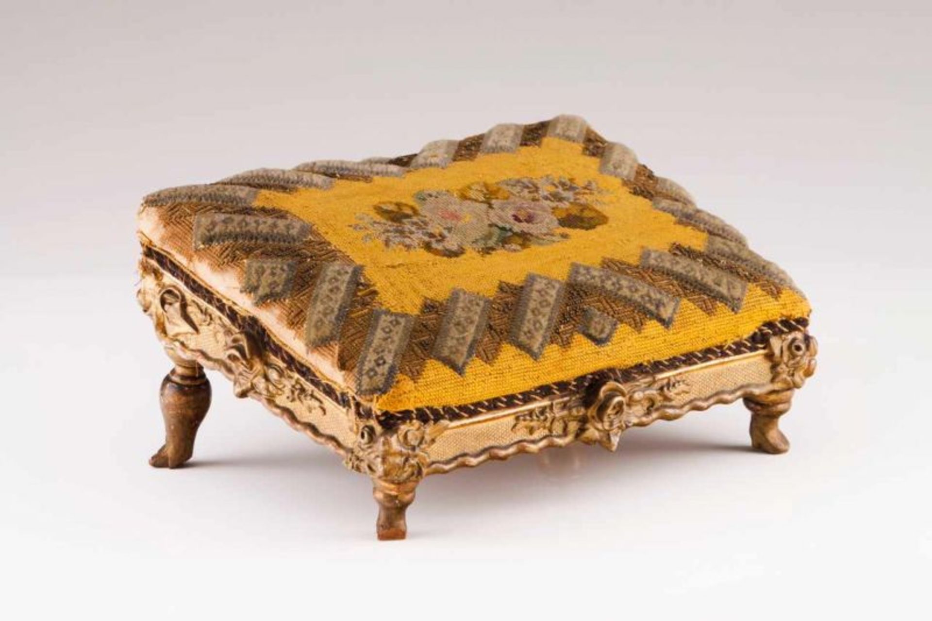 A Louis XVI style stool Carved and gilt wood Petit-point upholstered seat with trims (defect and