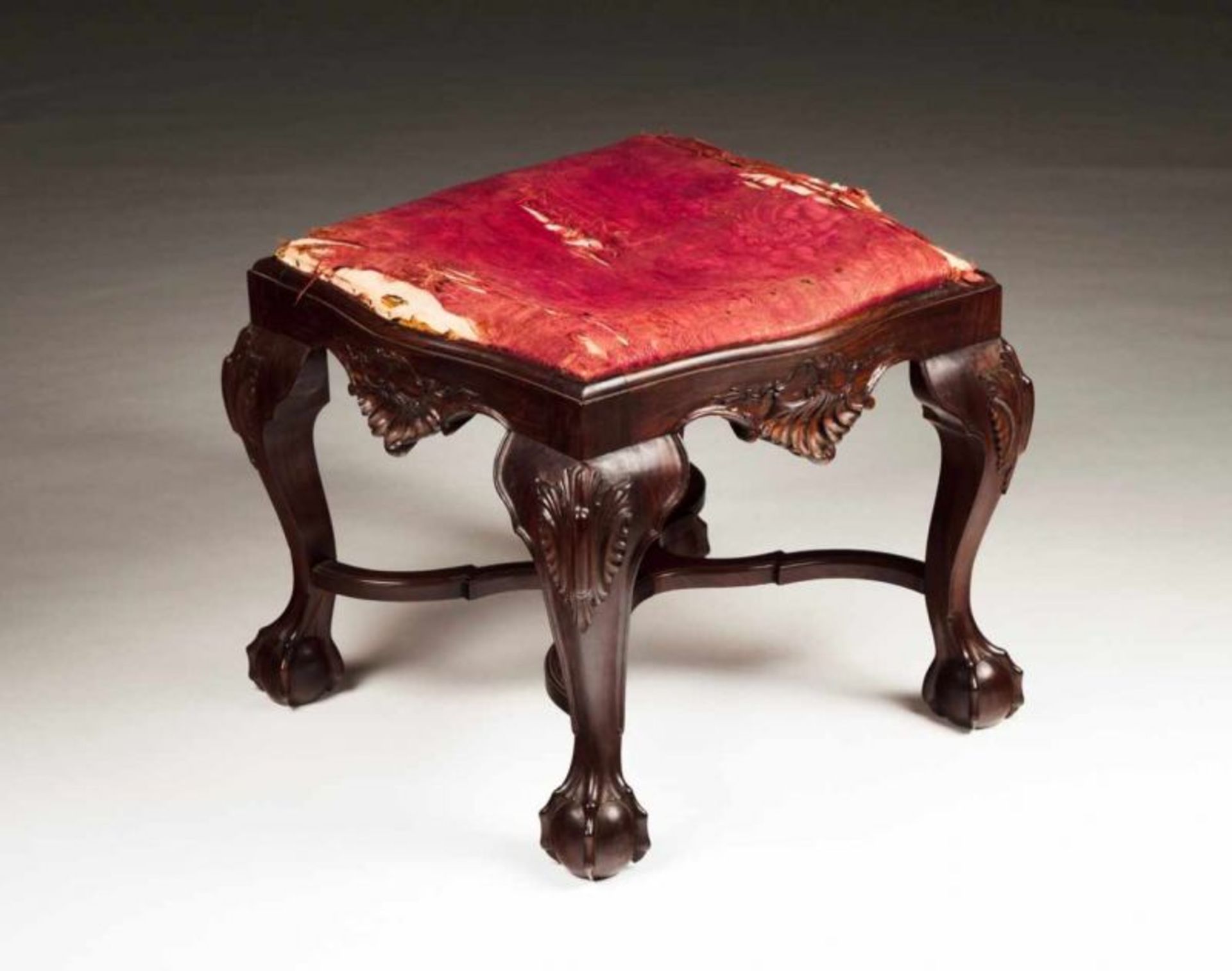 A D. João V style stool Rosewood Carved decoration Ball and claw feet Upholstered seat Portugal,
