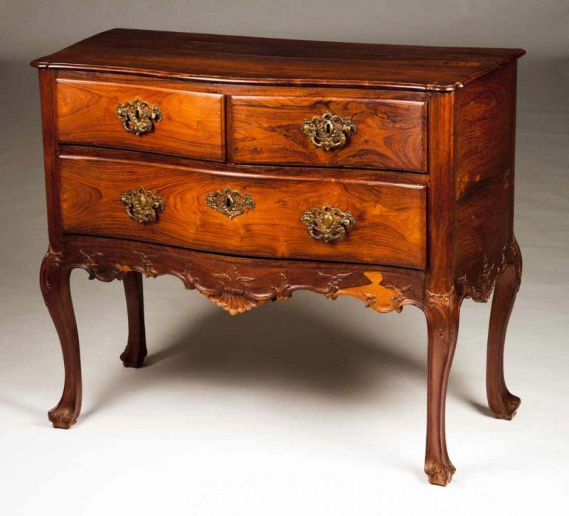 A D. José commode Rosewood Two short and one long drawers Scalloped and carved apron Portugal, 18th