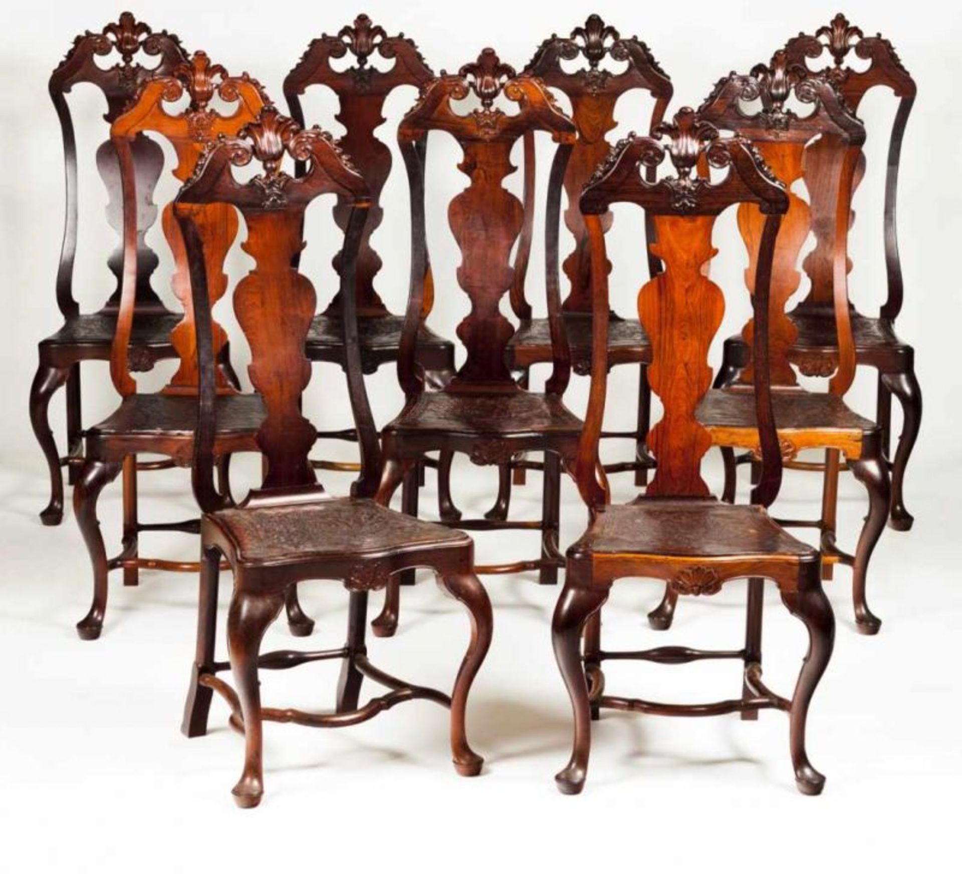 A set of nine D. José (1750-1777) chairs Rosewood Pierced and scalloped backs Engraved leather