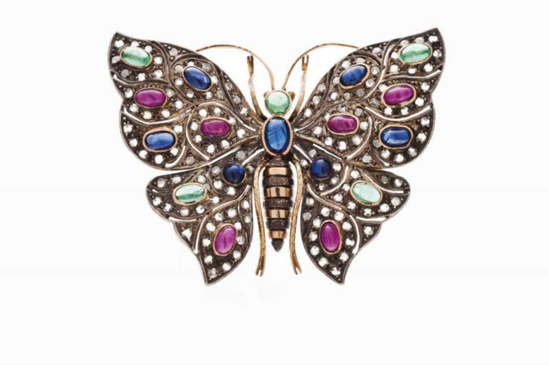 A "butterfly" brooch Set in silver and gold with rose cut diamonds and ruby, sapphire and emerald