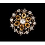 A brooch Set in silver and gold with six oval cut citrines, rose cut diamonds and one old