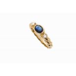 A ring Gold set with one oval cut sapphire and two brilliant cut diamonds Portuguese assay mark (