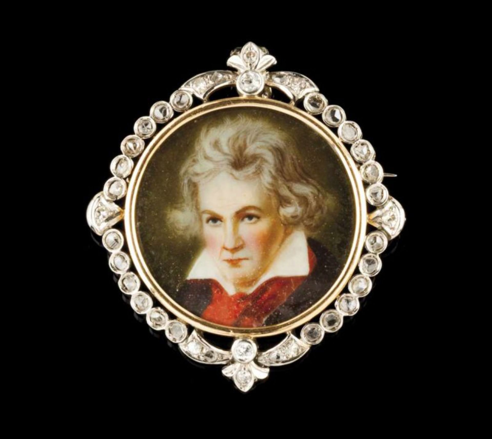 A pendant/ brooch Two-toned gold Centre with miniature depicting Beethoven and frame set with