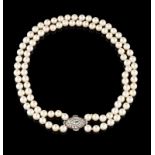 A two row pearl necklace Two rows of cultured pearls (8,5~9,00 mm) Art Deco clasp set in platinum