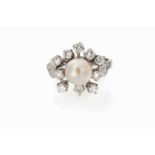 A ring Set in gold and platinum with cultured pearl and 12 brilliant cut diamonds (ca. 0,90ct)